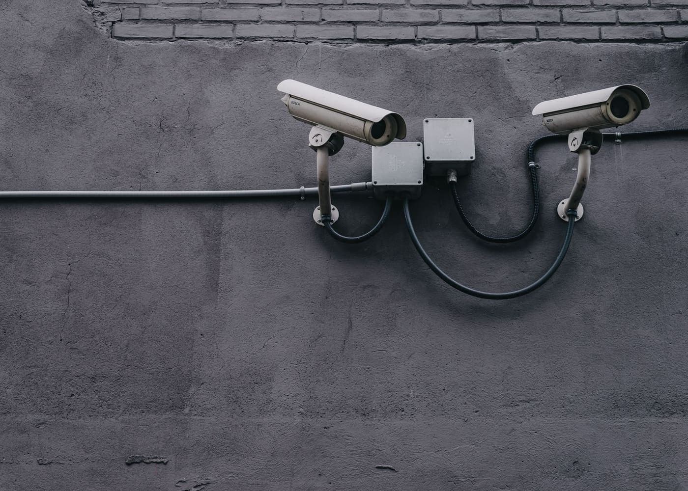 Professional outdoor CCTV cameras installed with conduit and junction boxes